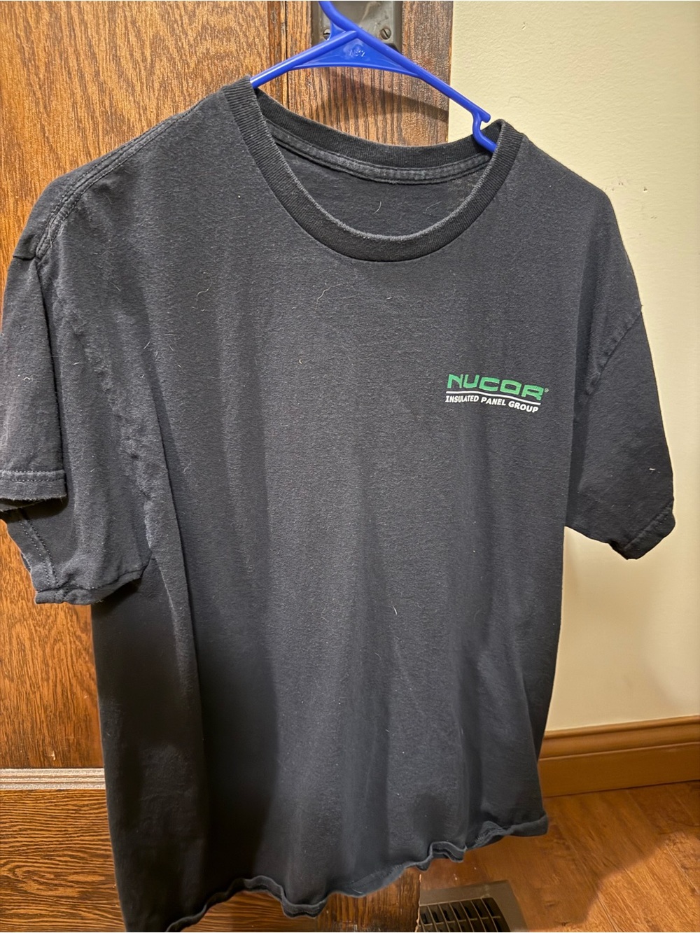 Black Short Sleeve Tee with Green Nucor Logo